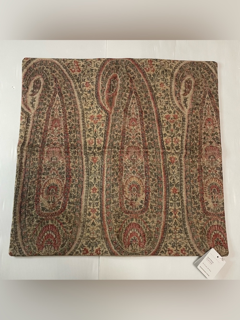 Pottery Barn Saffron Paisley print pillow cover in a red and green woven fabric
